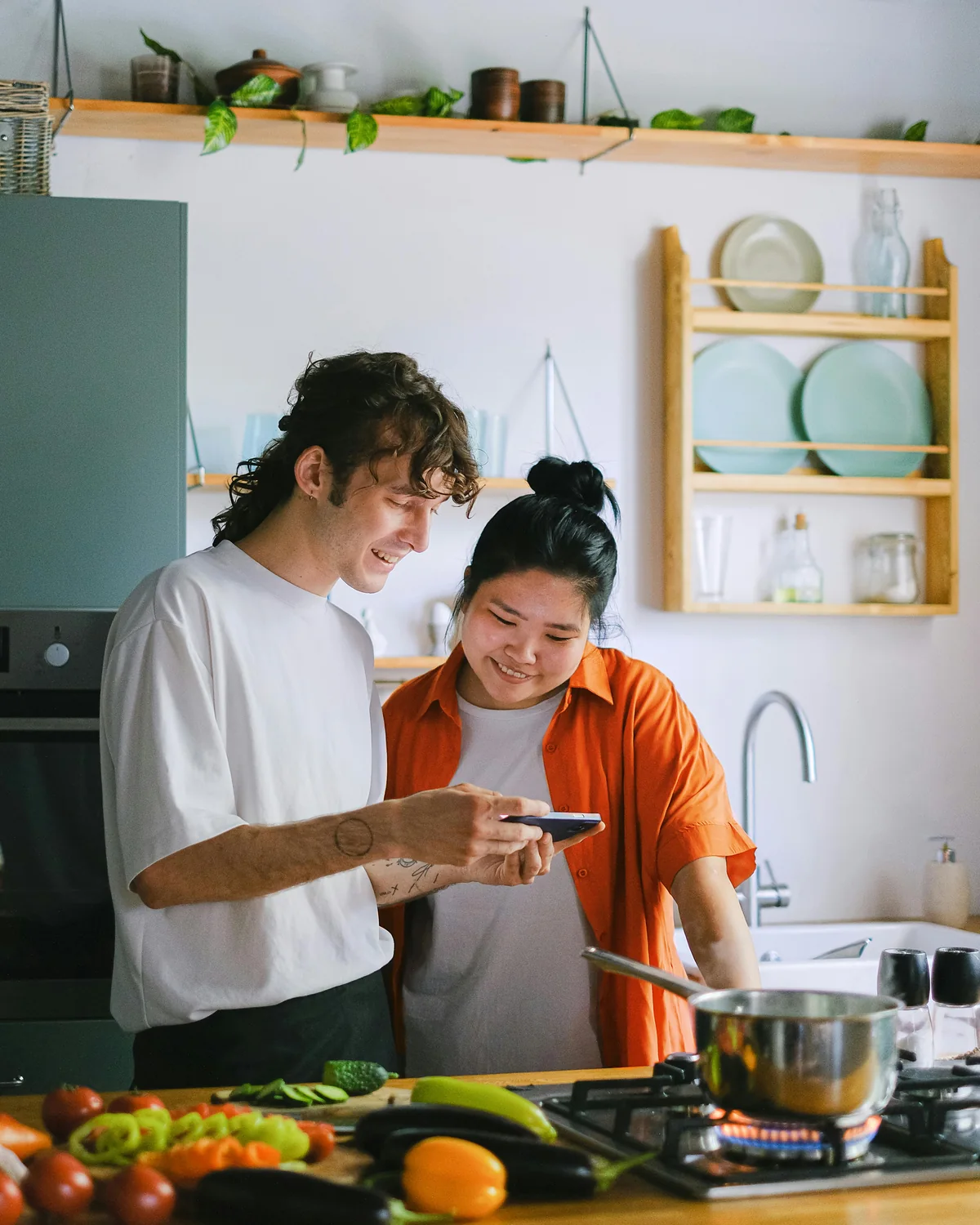 A couple cooking together at home
